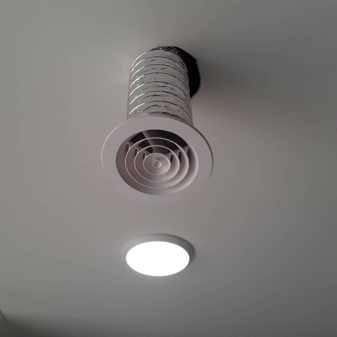 Solar roof ventilation ducted onto a ceiling vent