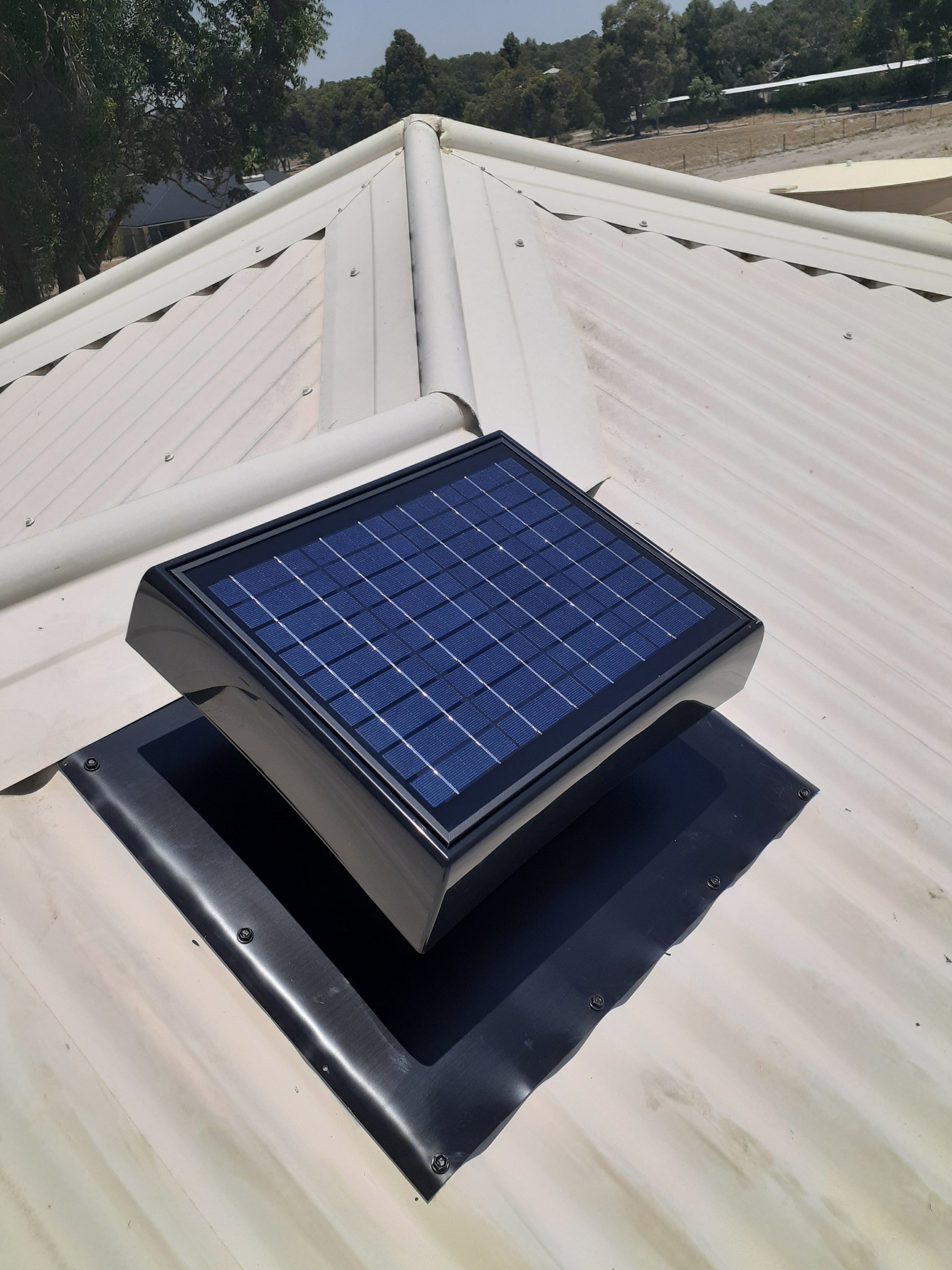 Solar roof ventilation installed over garage